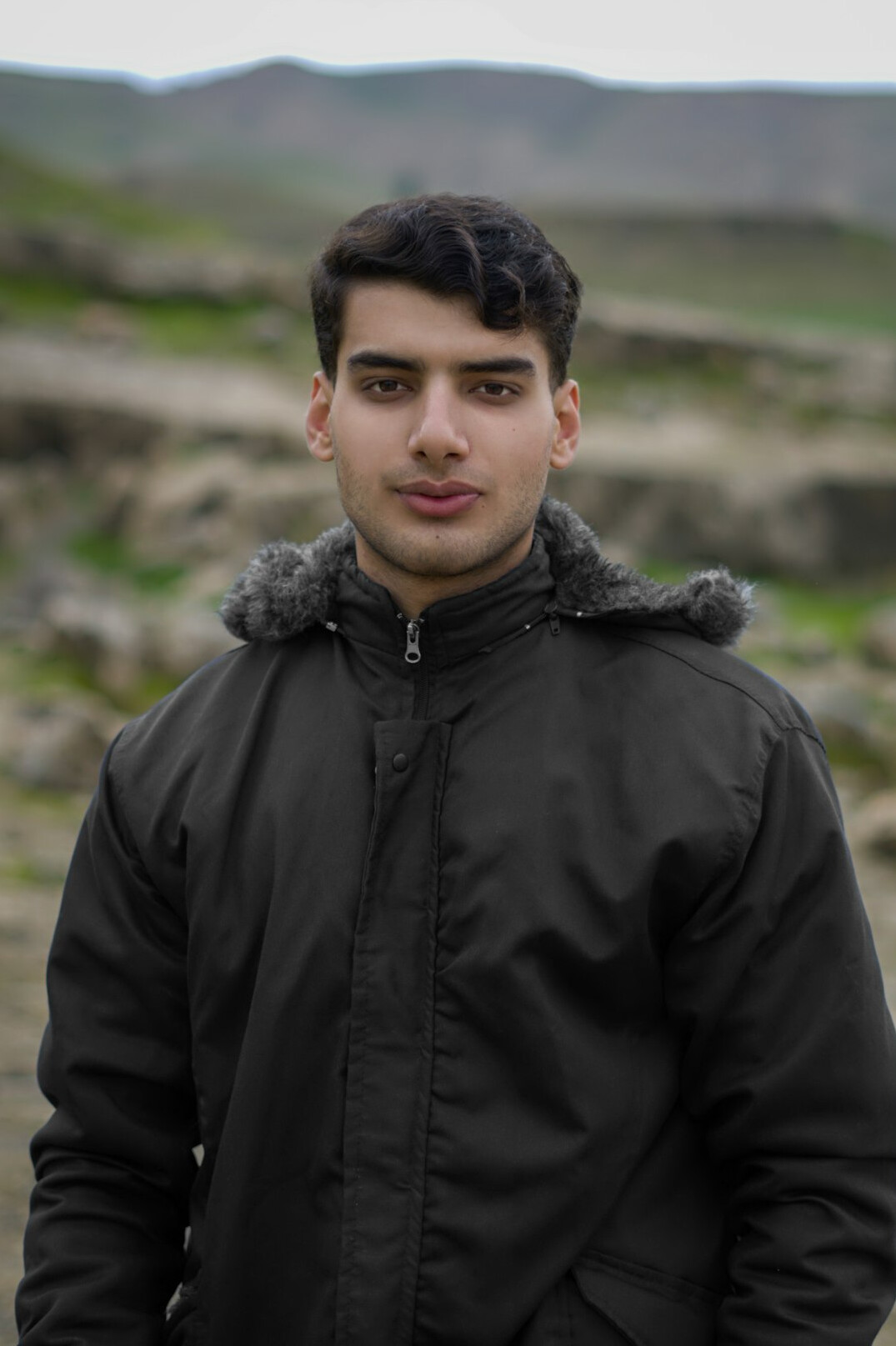 Turkish man on-air moderation specialist in a professional headshot